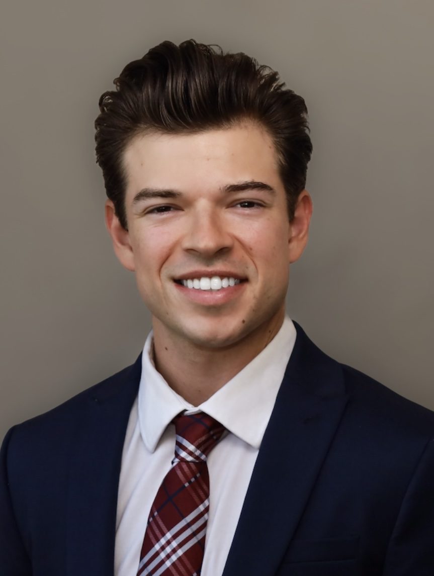 Headshot-1-e1772137874671.jpg